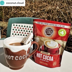 bag of hot cocoa next to mug