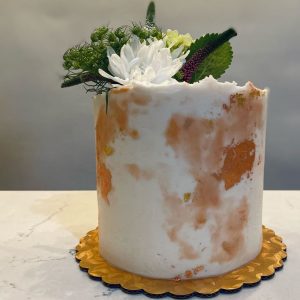 hazel and jade bakery vegan cake with fresh flowers and gold leaf