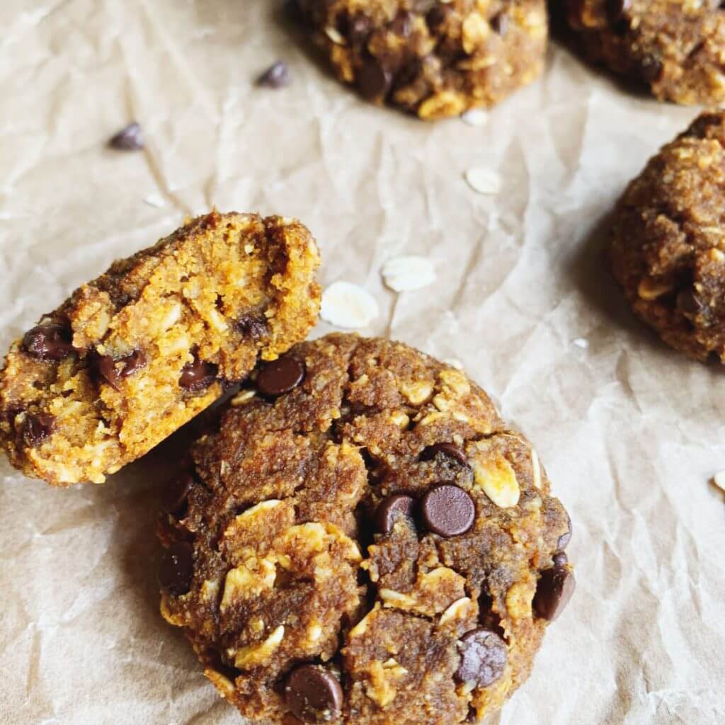 pumpkin spice oatmeal cookies with chocolate chips displayed on crinkly paper