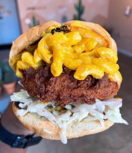 fried solar burger with mac n cheese and coleslaw
