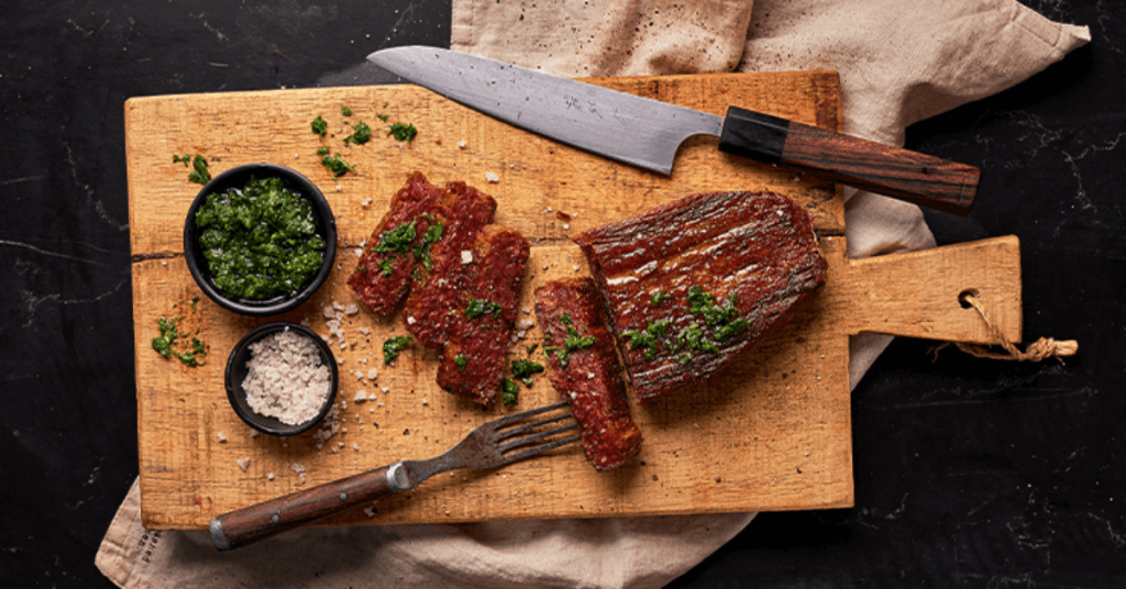 3D printed steak cut on cutting board