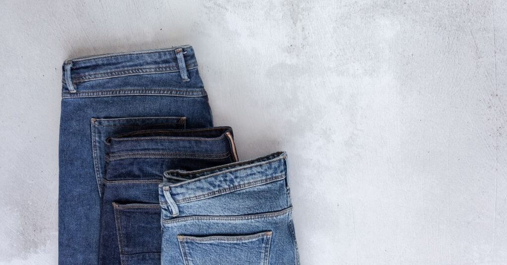three pairs of denim jeans