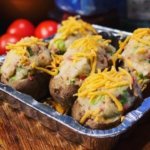 stuffed baked potatoes topped with shredded cheese