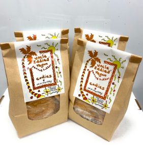 packages of uncle eddies vegan cookies brown paper bags