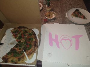 Hot tongue pizza in boxes being served