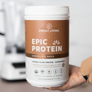 Hand Holding Container of Sprout Living Epic Protein Chocolate Maca
