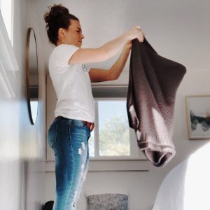 Woman folding towel