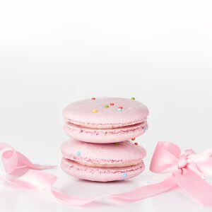 soft pink macarons with sprinkles and pink ribbon