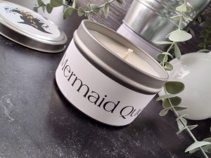 White mermaid candle with plant