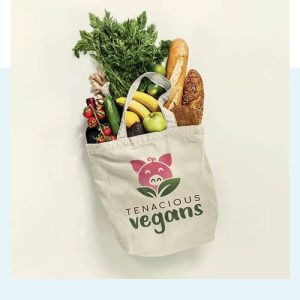 canvas tote bag stuffed with a variety of bread fruits and veggies