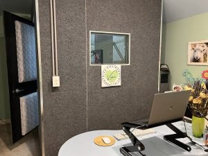 Plant-Powered Voiceover booth exterior with laptop in foreground