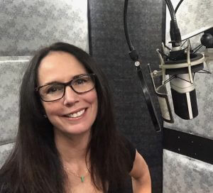 Marian Erikson wearing glasses in recording booth